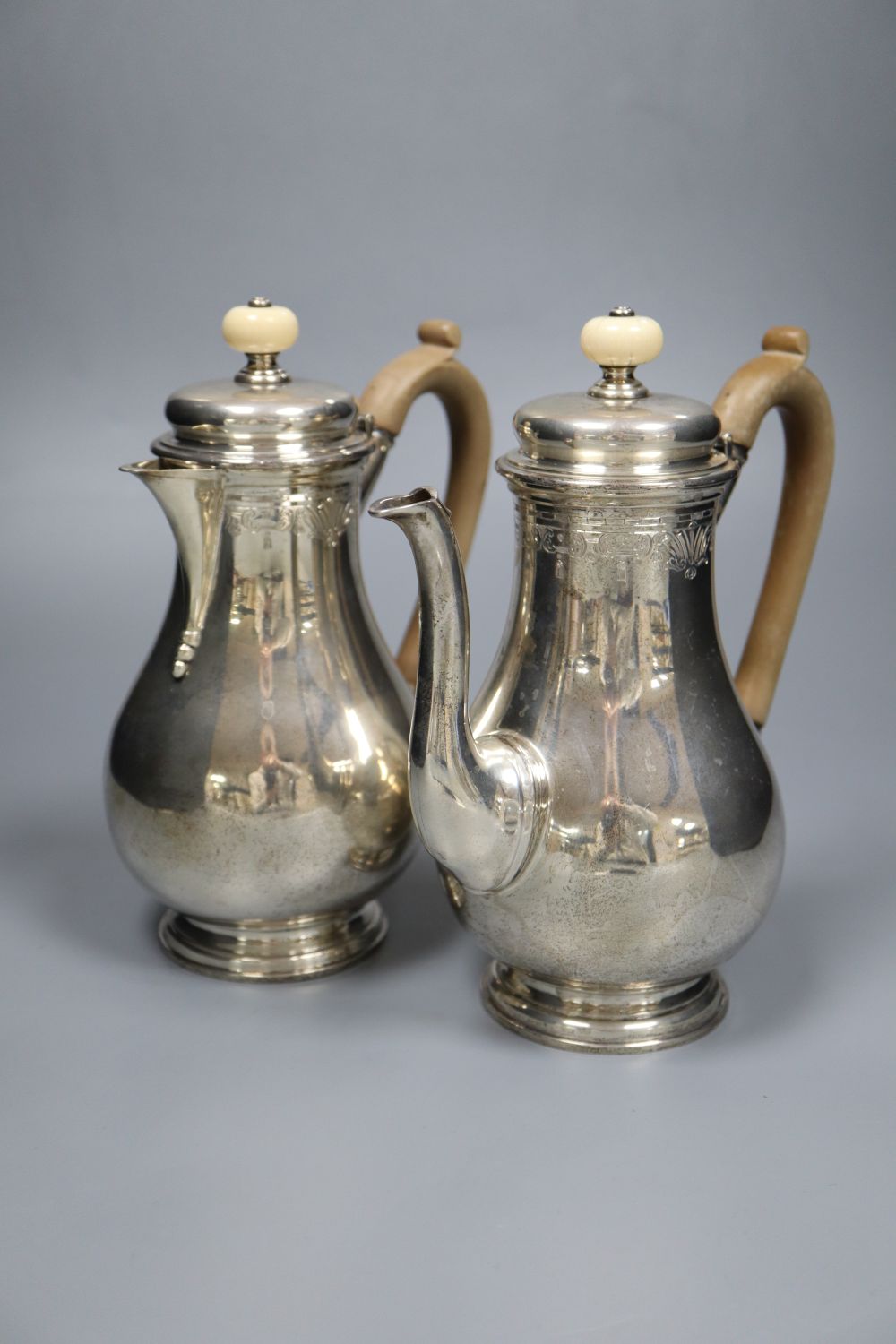 A George V silver cafe au lait pair by S.J. Phillips Ltd, London 1913, 20.5cm, gross 33oz.